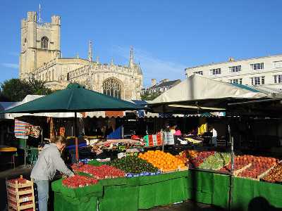 Cambridge market with Great St Mary's church in the background