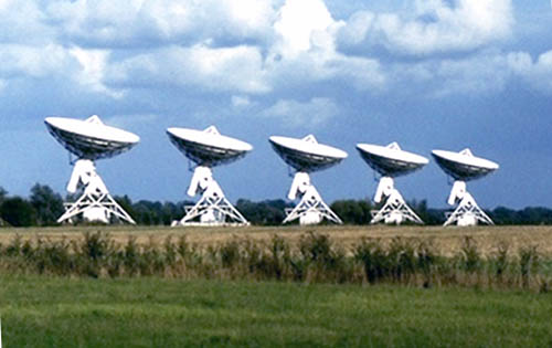 Radio telescopes by the Barton Road, built on a disused railway line
